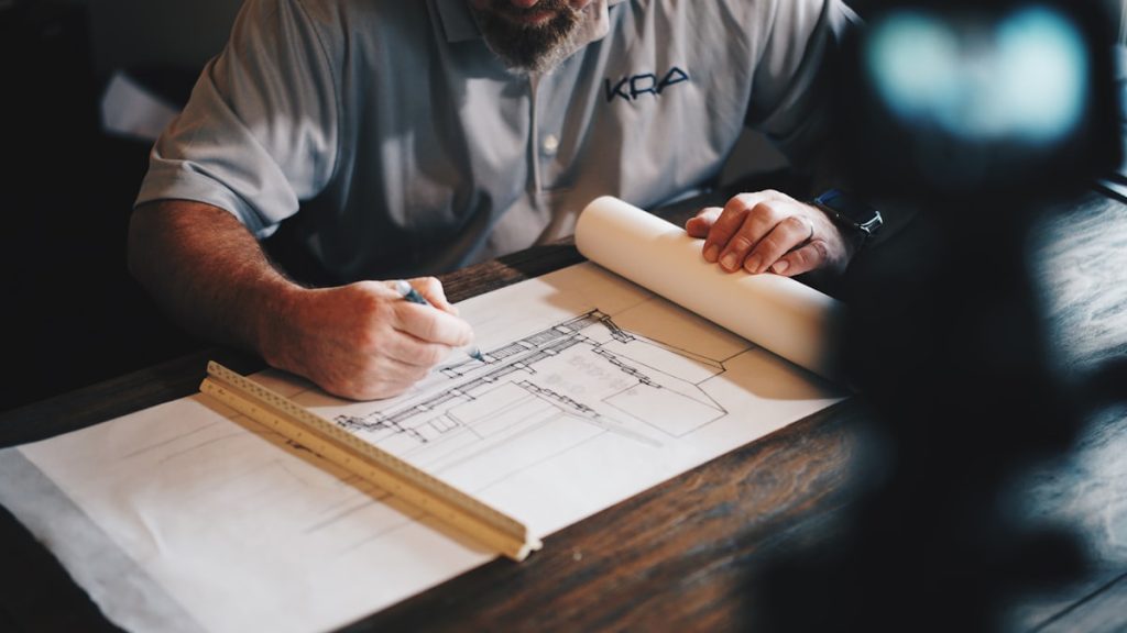 Detailed building plans being drawn up by hand