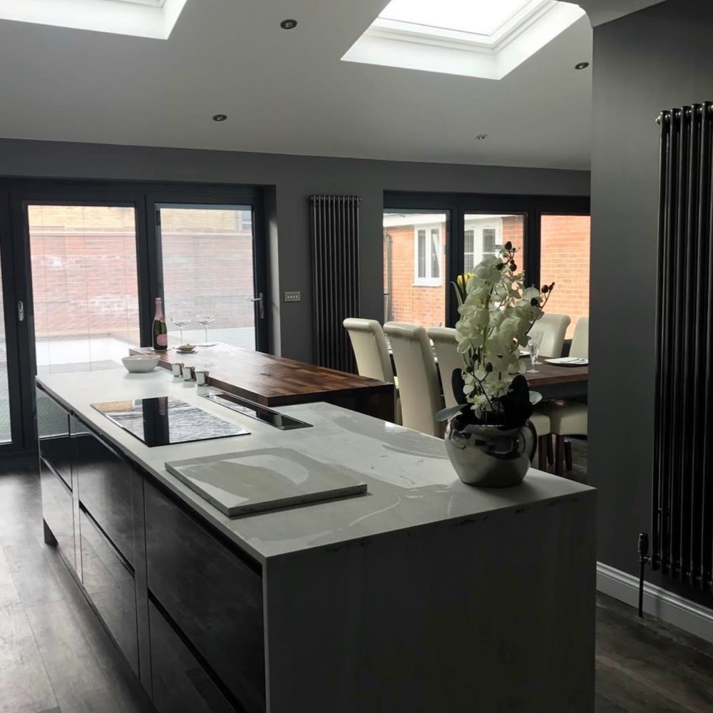 Open-plan kitchen diner with roof lights